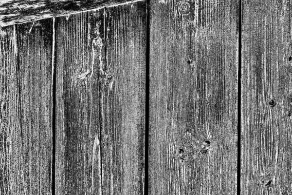 Old plank wooden wall background. The texture of old wood. Weathered piece of wood.