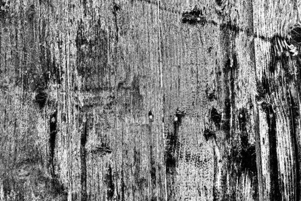 Old plank wooden wall background. The texture of old wood. Weathered piece of wood.