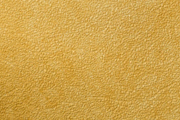 fabric background. the fabric is yellow. clean background. texture. place for text. tailor accessories. background for the tailor.