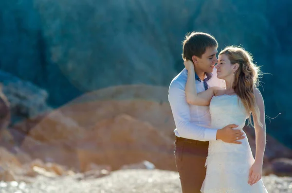 Lovely wedding couple softly hugging. Beautiful mountain landscape on background — Stock Photo, Image