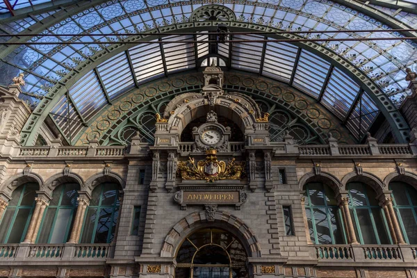 stock image Magnificent Antwerp Train Station Clock in Morning light. Eclectic historic architecture. Time maker. in central perspective. Unique Stone Building in Belgium , Europe.