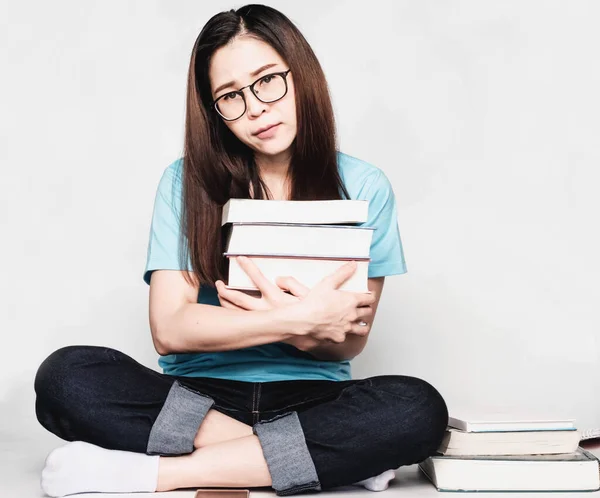 Beautiful asian female students during the exam Stay home and stressful and lazy reading books