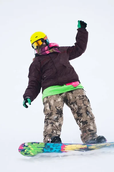 Teen snowboarder on the board — Stock Photo, Image