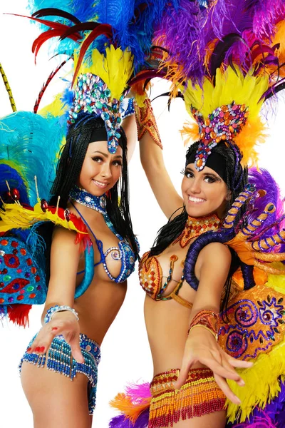 Dos hermosas chicas sonrientes en un colorido disfraz de carnaval — Foto de Stock