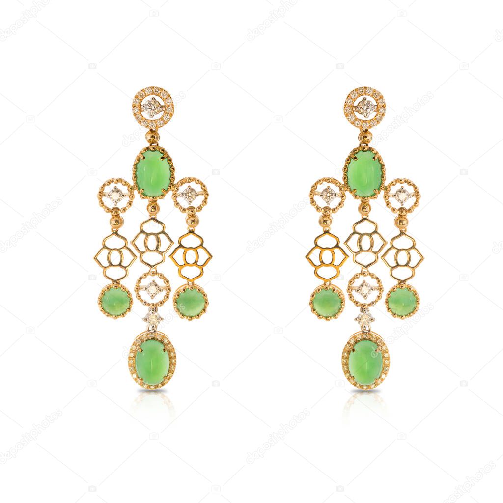 Yellow gold flowing earrings with diamonds and chrysoprase isolated on a white background