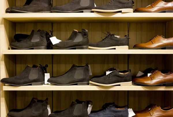 selling shoes in a store. shelf with shoes. shoe store