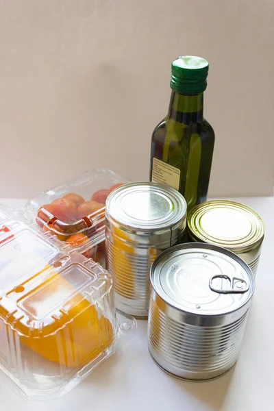 Donation in a box. The volunteer brought the products for people to self-isolation. Products on a background close-up, a place for an inscription. Products for the poor.