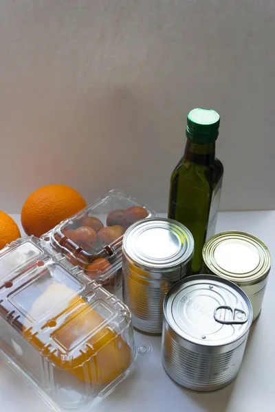 Donation in a box. The volunteer brought the products for people to self-isolation. Products on a background close-up, a place for an inscription. Products for the poor.