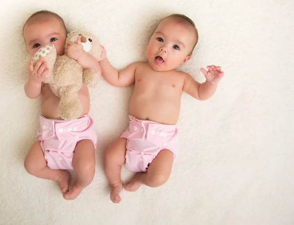 Baby Twins Girls Cloth Diaper Bed — Stock Photo, Image