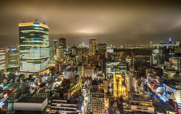 Rooftop View of Warm Amber City Skyline at Night in Nagatacho district of Tokyo, Japan
