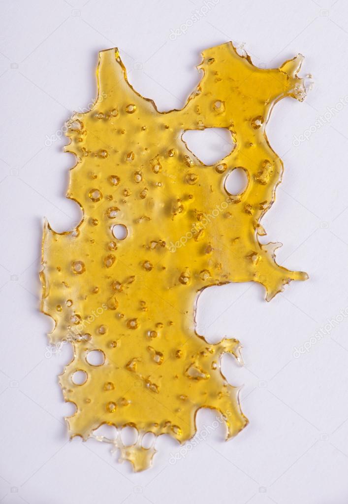 Slab of cannabis oil concentrate (aka shatter) isolated