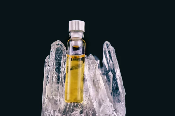 Detail of cannabis oil container and quartz crystal isolated on — Stock Photo, Image