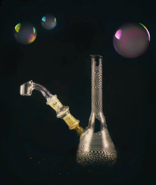 Dabbing glass rig with soap bubbles floating - isolated over bla — Stock Photo, Image