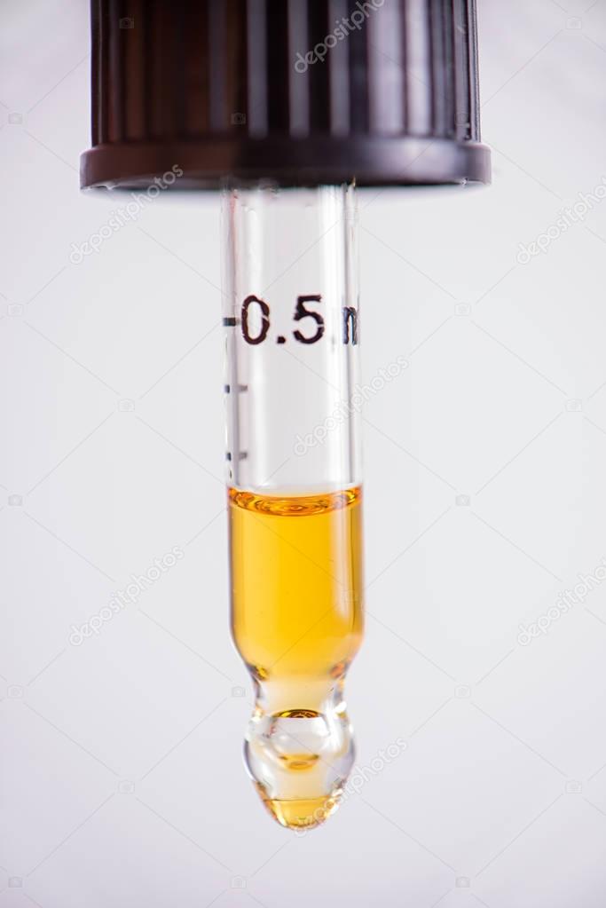 Dropper with CBD oil, cannabis live resin extraction isolated - 
