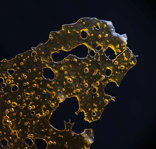 Close up detail of marijuana oil concentrate aka shatter isolate — Stock Photo, Image