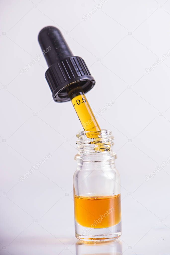 Dropper with CBD oil, cannabis live resin extraction isolated - 