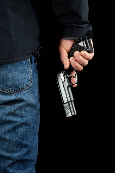 A man with a gun on a black background.