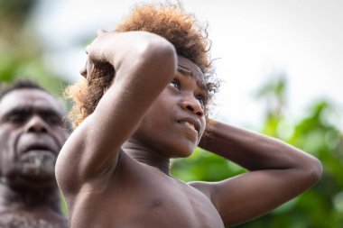 Pentecost island Vanuatu, South Pacific, Oceania : Melanesian boy portrait looking up smiling clipart