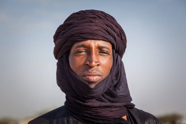 Ingall, Niger : Tuareg man in traditional turban close up clipart