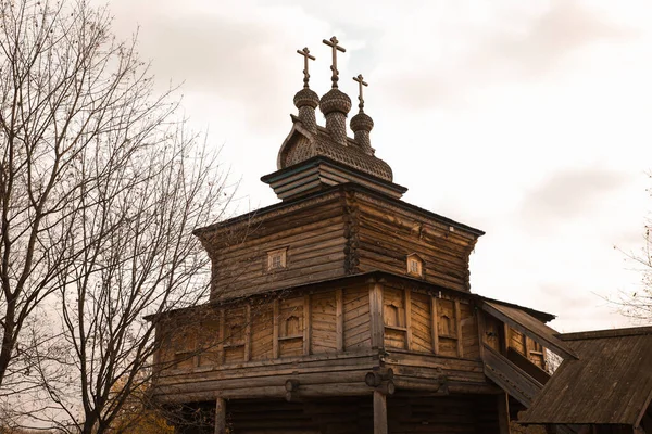 An old wooden structure with Christian poppy domes.