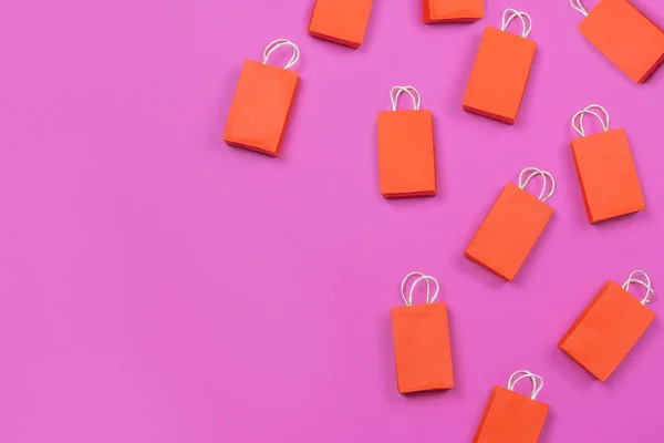 Muchas Bolsas Compras Rojas Sobre Fondo Rosa Espacio Copia Concepto — Foto de Stock