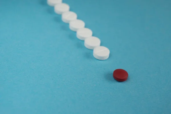 One Red Pill Many White Yellow Pills Blue Background Copy — Stock Photo, Image
