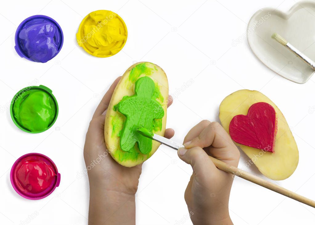 child playing with paints 