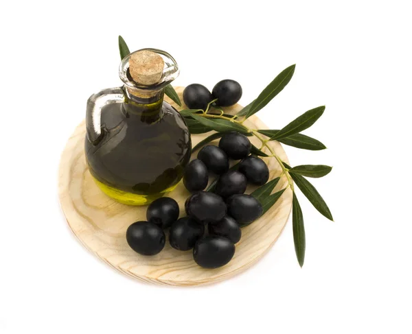 Fresh organic oil with picked olives — Stock Photo, Image