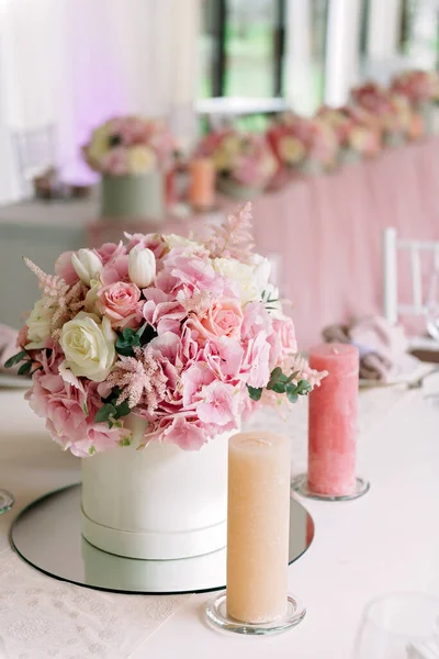 Table decor with flowers for a wedding party. Vertical