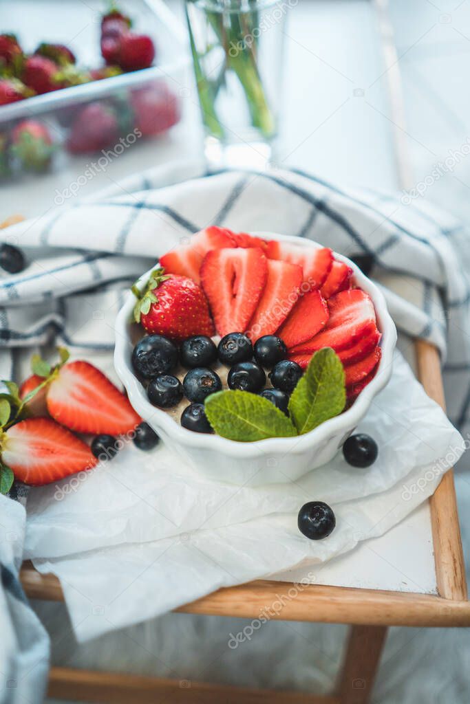 The best breakfast - Coconut milk rice with fresh strawberries, blueberries and mint