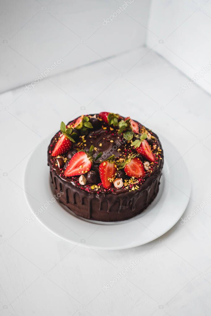 Chocolate cake with strawberries and nuts