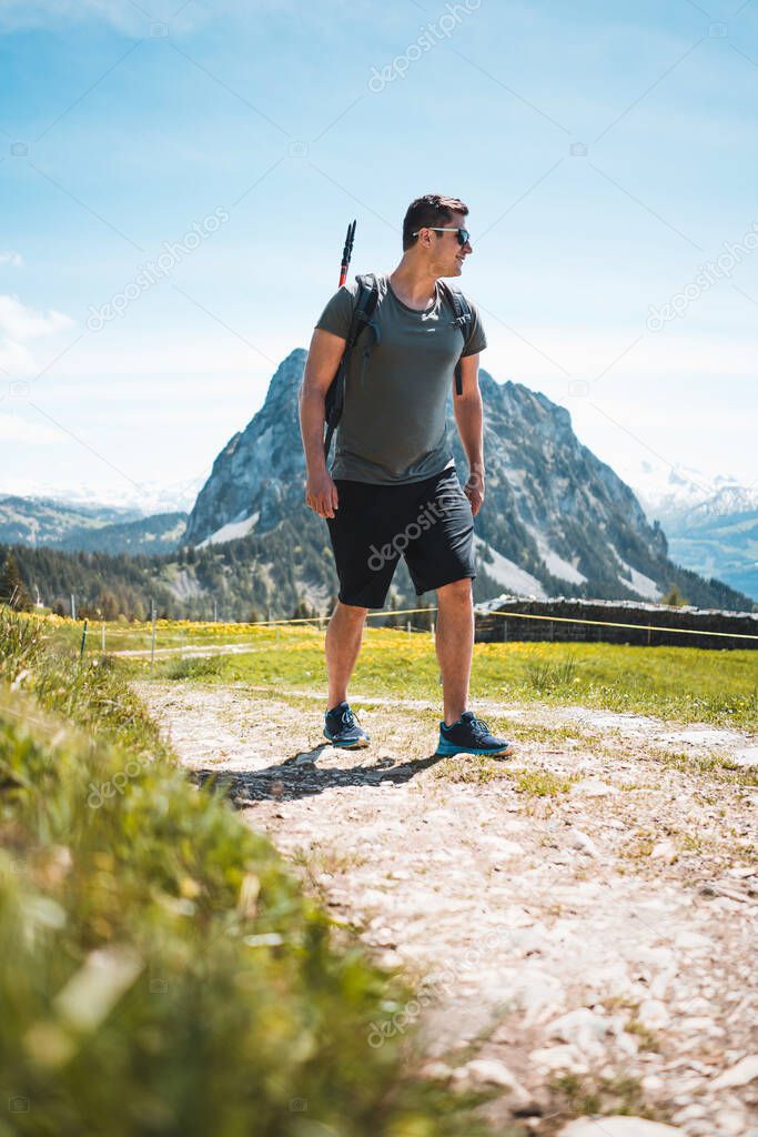 A man on his way through the swiss mountains