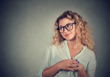 Lack of confidence. Shy young woman feels awkward 