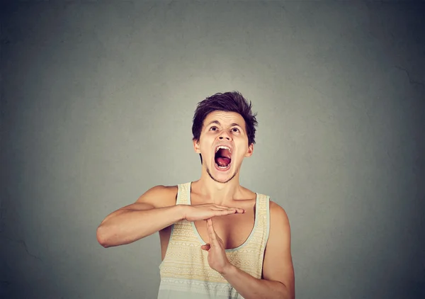 Man showing time out hand gesture frustrated screaming — Stock Photo, Image