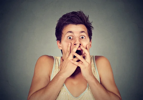 Young man looking shocked scared — Stock Photo, Image