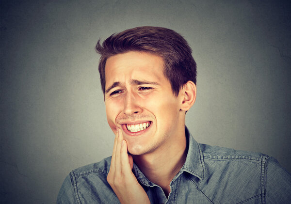 man with toothache crown problem about to cry from pain 