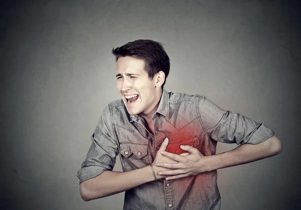 Adult man suffering from severe sharp heartache, chest pain — Stock Photo, Image