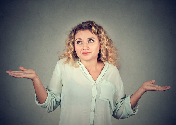 dumb looking woman arms out shrugs shoulders