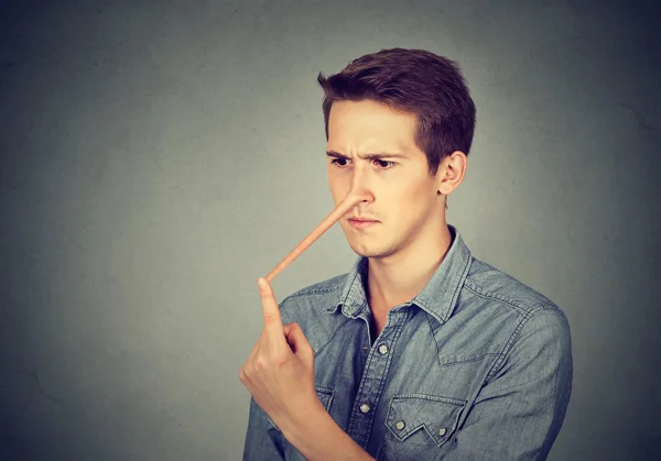 Man with long nose. Liar concept. — Stock Photo, Image