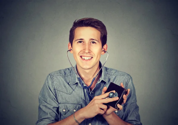 Man checking wallet with stethoscope. Concept of financial success. — Stock Photo, Image