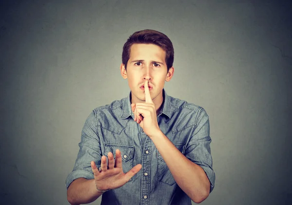 Young handsome man giving Shhhh quiet, silence, secret — Stock Photo, Image