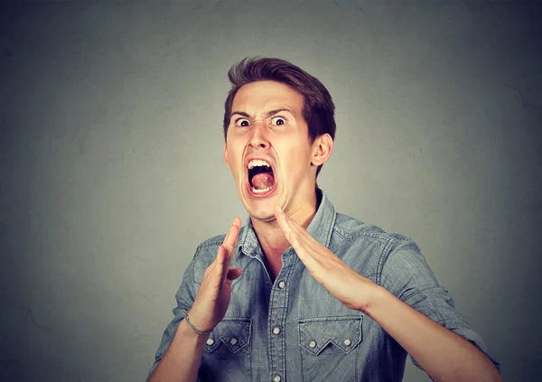 Angry, mad, furious man raising hands in air with karate chop — Stock Photo, Image