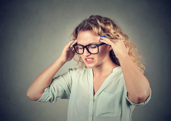 Sad young woman in glasses with worried stressed face expression — Stock Photo, Image