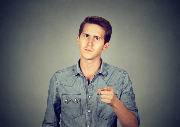 Angry young man pointing finger at you camera — Stock Photo, Image