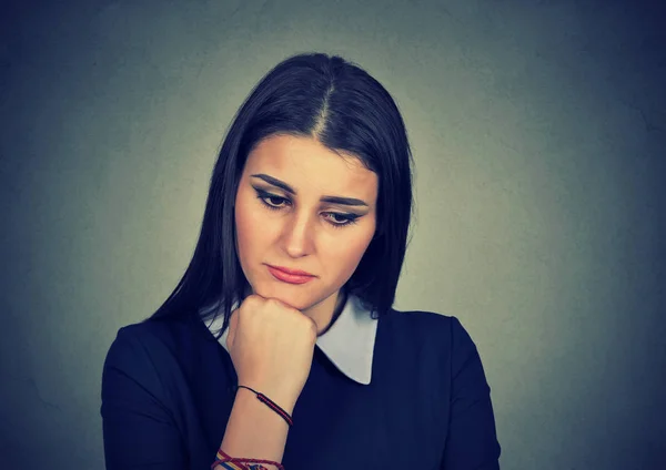 Woman with sad expression looking down — Stock Photo, Image