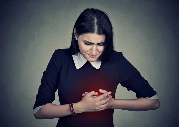 Woman with heart attack, pain, health problem holding touching her chest — Stock Photo, Image