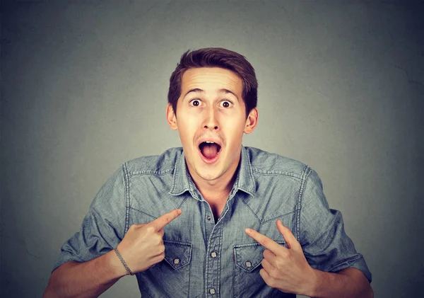 Young happy surprised man pointing at himself you mean me — Stock Photo, Image