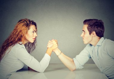 Business people woman and man arm wrestling   clipart
