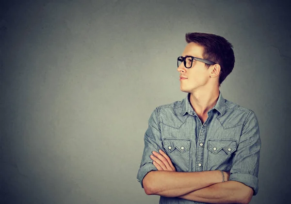 Young man looking at his side — Stock Photo, Image