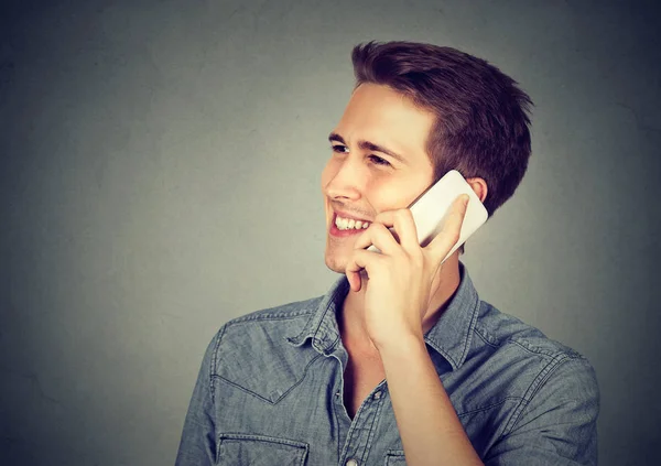 Man talking on mobile phone smiling Stock Picture